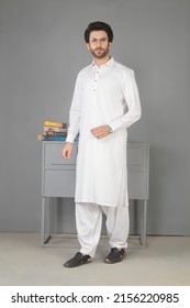 Karachi, Pakistan - Mmay 14, 2022: Pakistani Man In Traditional Wear  Kurta Pyjama Cloths. Male Fashion Model In Sherwani, Posing In Studio, Wedding Fashion Concept