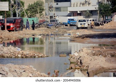 KARACHI, PAKISTAN - OCT 09: Commuters Are Facing Difficulties In Transportation Due To Stagnant Sewerage Water Due To Poor Sewerage System Negligence Of Concerned Dept. On October 09, 2021 In Karachi.