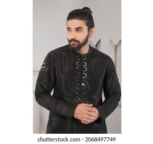 Karachi, Pakistan - October 29, 2021: Young Pakistani Men Wearing Shalwar Kameez (kurta). Fashion Concept