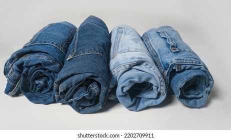 Karachi, Sindh  Pakistan - 09142022 - Selective Focus Image Of Rolled Up Denim Pants Laying Flat On A White Surface In A Denim Factory In Site Area, Karachi