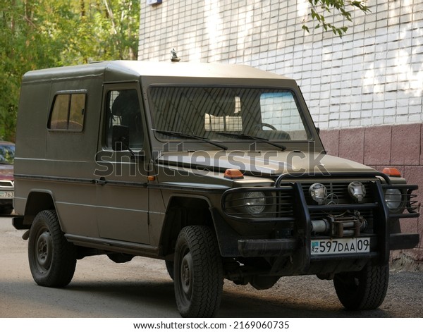 Karaganda, Kazakhstan - 27.08.2020: :\
Mercedes G-Class (G-Wagen) car parked in the streets of city with\
typical khaki coloured\
camouflage.