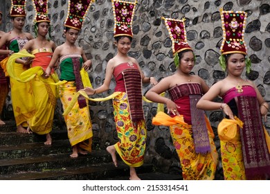  Karangasem, BaliIndonesia - November 20 2021: The beautiful balinese Rejang dancer with the colorful of the traditional costume.                             