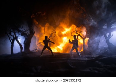 Escena de la lucha nocturna de atletas de karate en el bosque en llamas. Carácter karate. Decoración de ilustraciones. Concepto deportivo. Fondo nebuloso decorado con luz. Enfoque selectivo