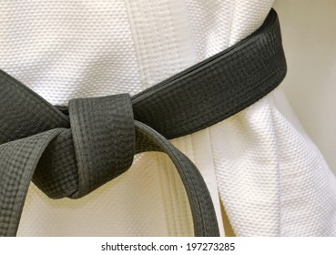 Karate Black Belt on White Uniform - Powered by Shutterstock