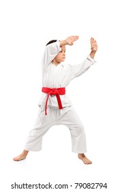 Karate boy exercising isolated against white background