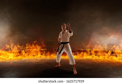 Karate Fighter On Fire Background.