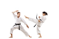 The studio shot of group of kids training karate martial arts featuring ...