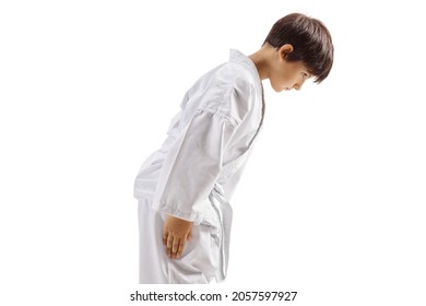 Karate kid in white kimono bowing isolated on white background