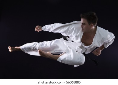 karate man champion of the world on black background studio shot - Powered by Shutterstock