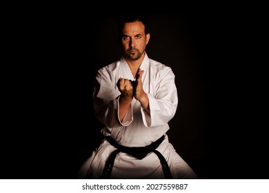 karate man kicked in hand - Shutterstock ID 2027559887