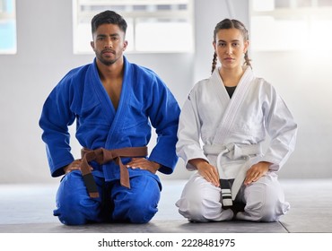 Karate, man and woman in portrait together with focus determination for fitness, wellness or training. Couple, martial arts and sitting knees in gym, dojo or club for exercise, fight sport or workout - Powered by Shutterstock