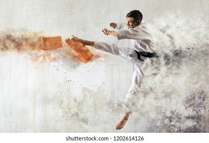 Karate Masters Breaking With Leg Wooden Board