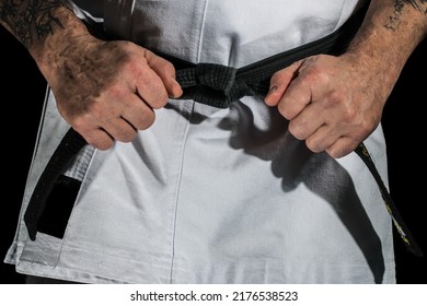 Karate Sensei Strapping On His Belt