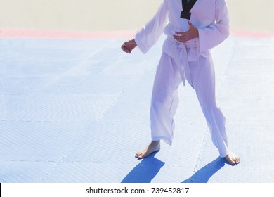 Karate , Tae Kwon Do , Martial Arts. A Kid , Teenager Man , Wearing White Kimono With Black Belt . Extreme Fight Sports. Concepts Of Becoming A Professional Fighter