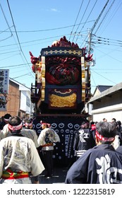 Karatsu, Japan - november 3, 2018 : people in traditional costumes drawning "The Boat of seven treasures" float through the street during Karatsu city annual "kunchi" parade