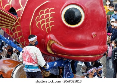 Karatsu, Japan - november 3, 2021 : the massive float representing a sea bream is drawn through the streets during annual Karatsu Kunchi traditional festival.