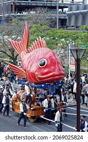 Karatsu, Japan - november 3, 2021 : the massive float representing a sea bream is drawn through the streets during annual Karatsu Kunchi traditional festival.