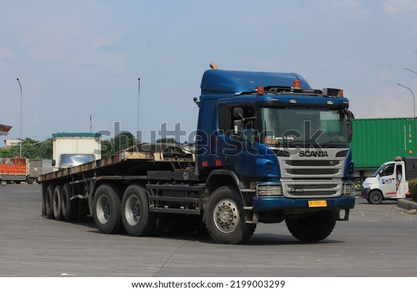 Karawang, West Java, Indonesia - March 30, 2019\
: Scania P410 trailer truck at the rest area of ​​the\
Jakarta-Cikampek toll road kilometer 57 at\
noon.