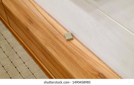 "Karbala" stone or "turbah" clay on the wooden desk. - Shutterstock ID 1490458985