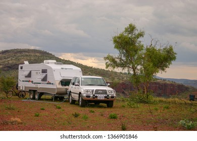 Karijini, Australia - 25 Apr 2007: Four wheel drive vehicle and large caravan  in the outback of Australia. In winter retired Australians venture into the outback