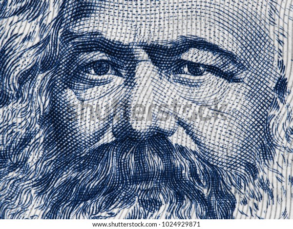 Karl Marx\
portrait on East German 100 mark (1975) banknote closeup macro,\
famous philosopher, economist, political theorist, sociologist and\
revolutionary socialist.