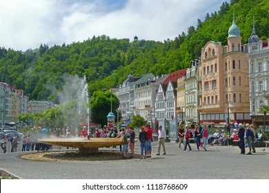 Karlovy Vary, Czech Republic - May 20 2018: People watching famous geyser Vridlo