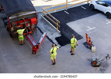 Karlshamn, Blekinge, Sweden. August 12, 2022. Workers From Garnborns Åkeri Paving A Parking Lot In Karlshamn With Asphalt.