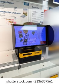 Karlsruhe, Germany - March 12, 2022: Front view of modern Kodak Picture Kiosk inside large supermarket - used to print customers photographs from mobile media and smartphones usb keys and sd cards