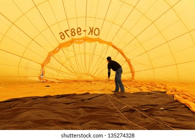 KARLSTEJN, CZECH REPUBLIC - APRIL 14: Baloon Inside. Unidentified Crew  Preparing Hot Air Baloon To Fly. Baloon Event On April 14, 2013 In Karlstejn, Czech Republic.