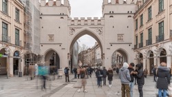 Karlstor In The Old Town Of Munich Timelapse With Unidentified People Walking On The Street. The Karlstor Is The Western City Gate Of The Historic Old Town. Entrance To Kaufingerstrasse. Germany
