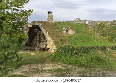 Karlukovo, Lukovid, Bulgaria - October 4, 2020: Stone house near Karlukovo village, Bulgaria. The roof is covered with grass. Cloudy day.