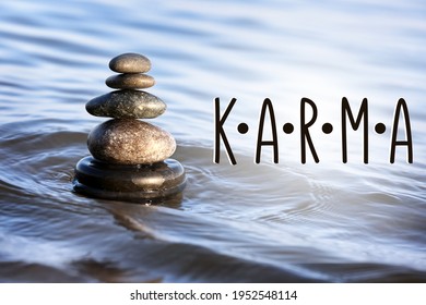 Karma Concept. Stack Of Stones In Sea Water