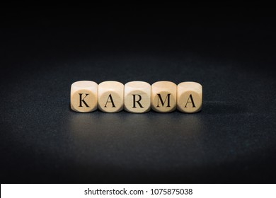 Karma Word On Wooden Cubes. Karma Concept