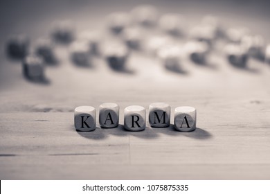 Karma Word On Wooden Cubes. Karma Concept