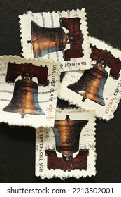 Karnal, Haryana, India -October 11th, 2022-Closeup Of Commemorative Postal Stamps Of USA Depicting Bell With Message USA First Class Forever.