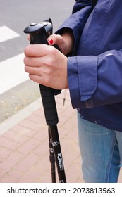 KARPACZ, POLAND - Oct 15, 2013: A Vertical Shot Of A Person Holding A Branded Hiking Stick