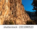 The karst calcareous rock formation of the the steep cliff above the coastal town Positano, Amalfi Coast, Italy, Campania, Europe. Geostructural carbonate rocks in Apennine mountains. Path of the Gods