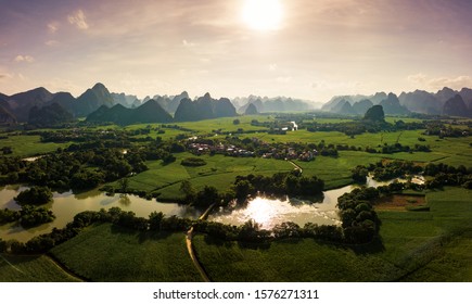 Karst landscape and agricultural fields in Guangxi province at south China aerial view at sunset