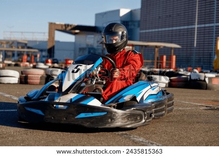 Kart pilot ready to start championship in outdoor go-karting circuit