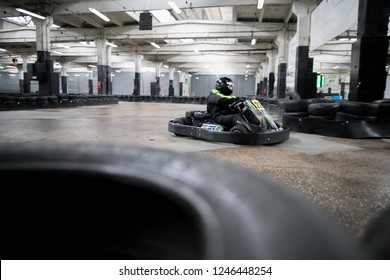 Karting Championship. Driver In Karts Wearing Helmet, Racing Suit Participate In Kart Race. Karting Show. Children, Adult Racers Karting.