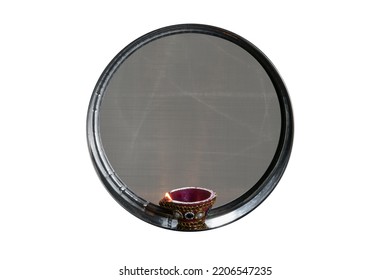Karwa Chauth strainer and Diya oil lamps for the Karwa Chauth celebration are isolated over white background