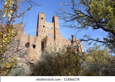 Kasbah Tamdaght With Trees Against Blue Sky.