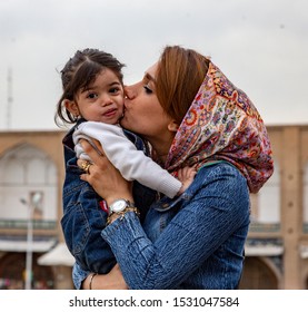 Kashan, Iran - 2019-04-14 - Naqshe Cehan Square Mother Kissed Reluctant Child.