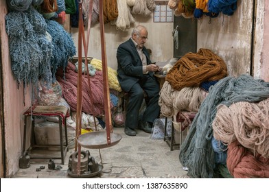 Kashan, Iran, 25th April 2019: Old Iranian Shop Keeper In His Shop At A Market