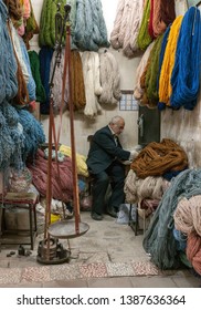 Kashan, Iran, 25th April 2019: Old Iranian Shop Keeper In His Shop At A Market