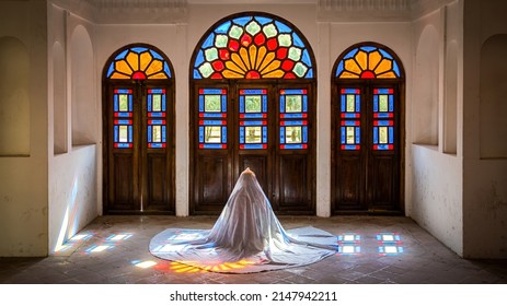 Kashan, Iran - May 2019: Unidentified Iranian Woman In Chador Hijab Praying Inside Tabatabaei Natanzi Khaneh Historical House