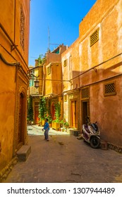 KASHGAR, CHINA - JUNE 2017: Old Town Common Uyghur Architecture Apartment Buildings Street With School Children