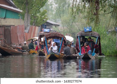 Kashmir, India - 16 April 2019: Kashmir merchants are selling tea to tourists at the floating market on Dal Lake. Early in the morning it is a major tourist attraction in Kashmir