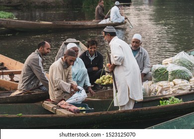 KASHMIR, INDIA - 20th SEPT 2019; Morning view of traditional floating market at Dal Lake of Kashmir, India. Since 1947 the ownership of Kashmir has been disputed between Pakistan and India.