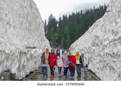 Kashmir, India - April 18 : Unidentified tourists take a photo snow wall on Sonamarg Alpine Route,Srinagar Alp in Kashmir, india on April 18, 2016.